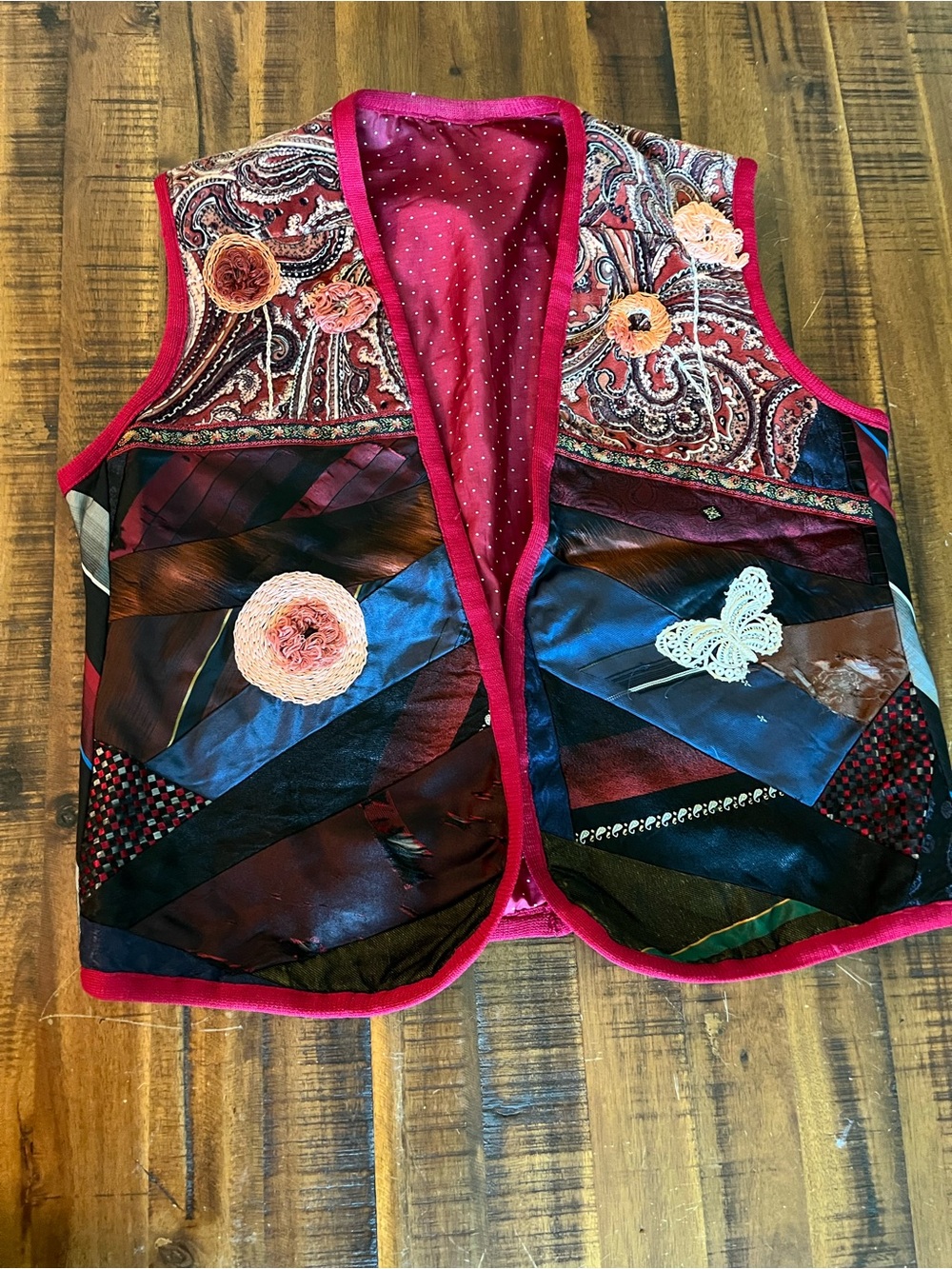 A patchwork vest made w vintage ties and embroidery accents